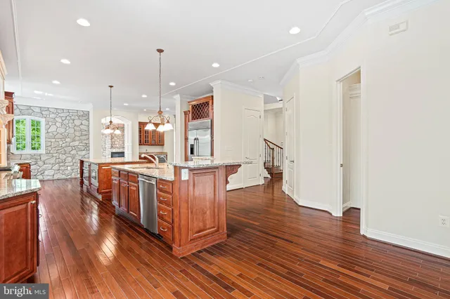 a stove top oven sitting inside of a kitchen