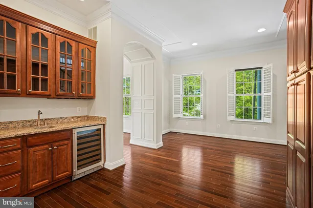 a view of entryway with wooden floor and stairs
