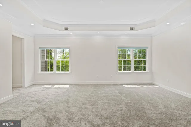a white bath tub sitting next to a window