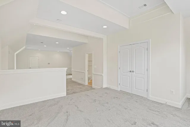 a view of a yard with plants and trees