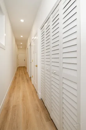 a view of a hallway with stairs