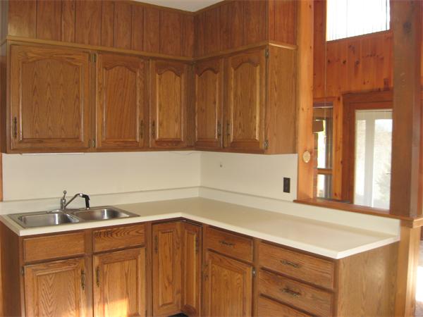 64 Worcester Road Westminster, MA 01473 - Photo 12 of 24 a kitchen with a sink and cabinets
