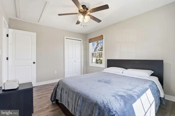 a bedroom with a bed and a table