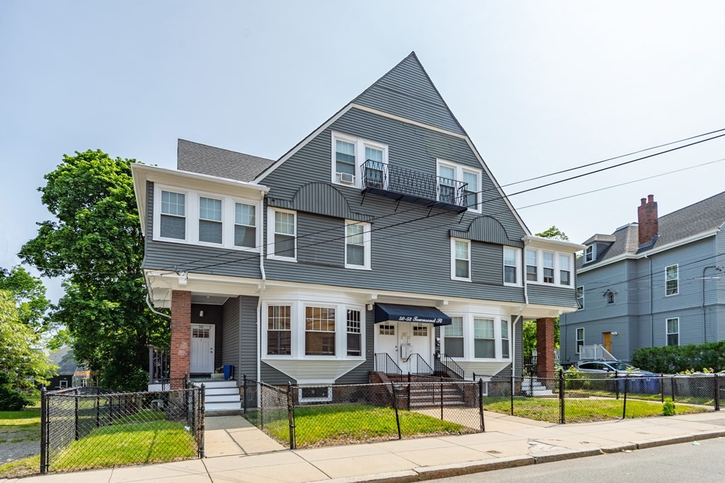 50-52 Townsend Street Boston, MA 02119 - Photo 1 of 15 a view of multiple houses with a swimming pool