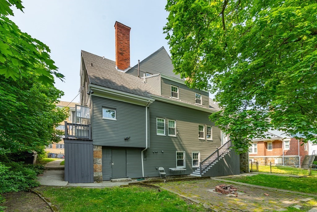 50-52 Townsend Street Boston, MA 02119 - Photo 15 of 15 a front view of a house with a yard