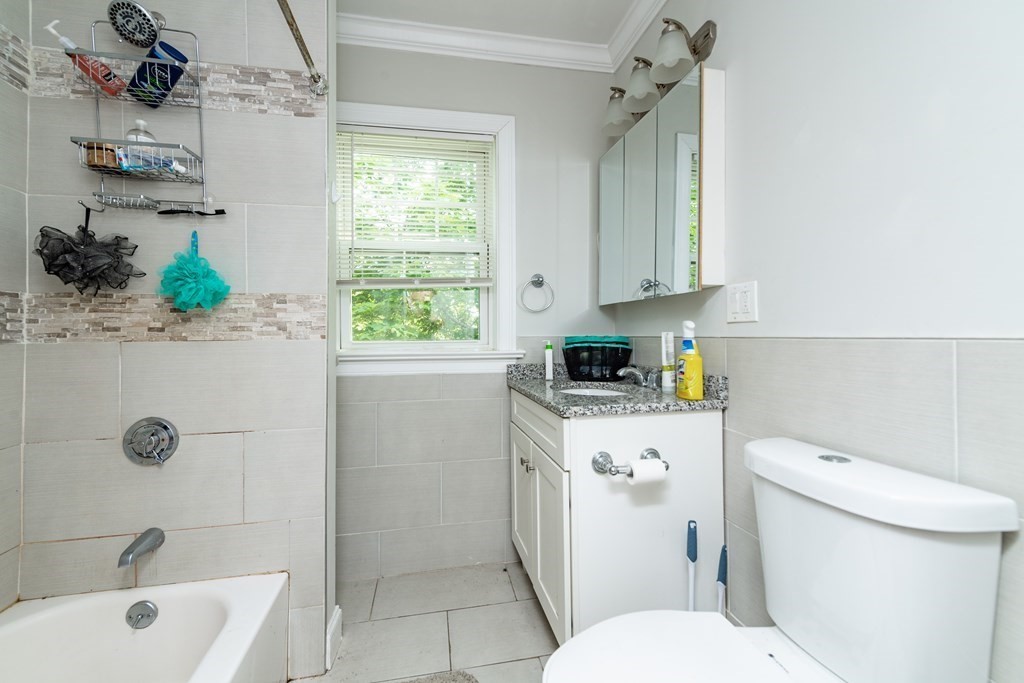 50-52 Townsend Street Boston, MA 02119 - Photo 5 of 15 a bathroom with a sink a toilet and shower