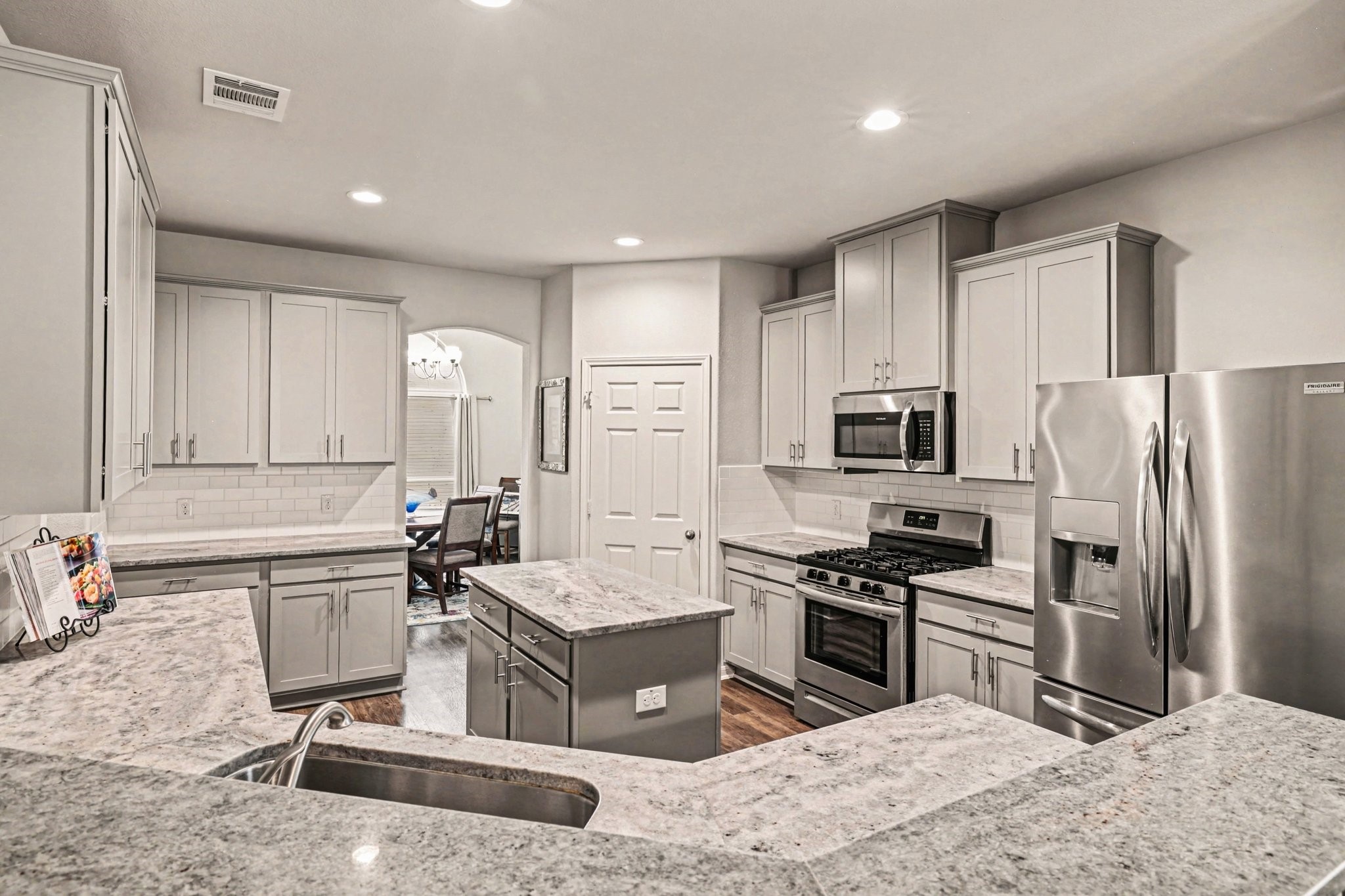 Well-designed kitchen with ample counter space, walk-in pantry, and classic finishes. Refrigerator included!