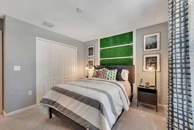 a bedroom with a bed and a cabinets