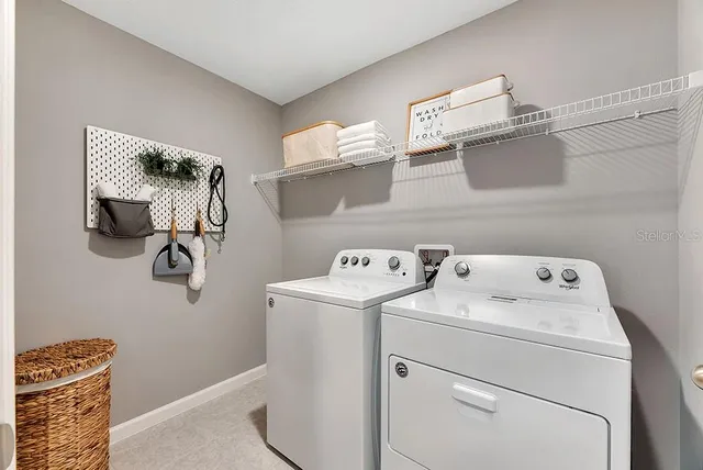 a utility room with dryer and washer
