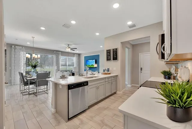 a kitchen with sink and center island