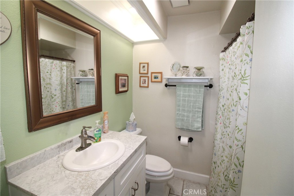 10113 Devon Street Rancho Cucamonga, CA 91730 - Photo 16 of 37 a bathroom with a sink toilet and shower