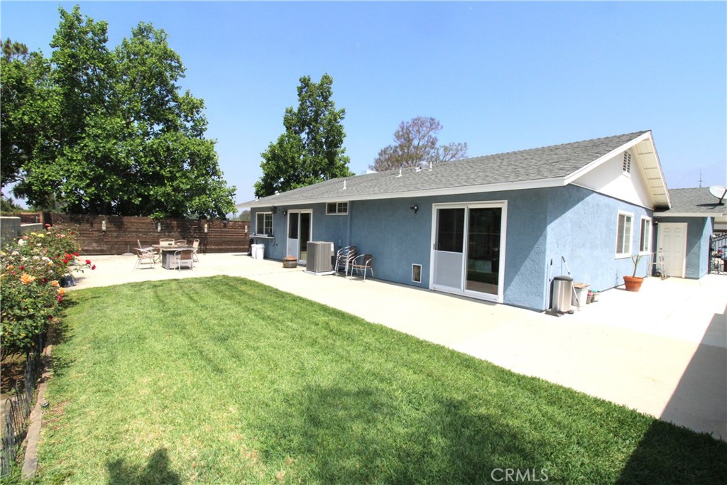 10113 Devon Street Rancho Cucamonga, CA 91730 - Photo 24 of 37 a house view with a sitting space and garden