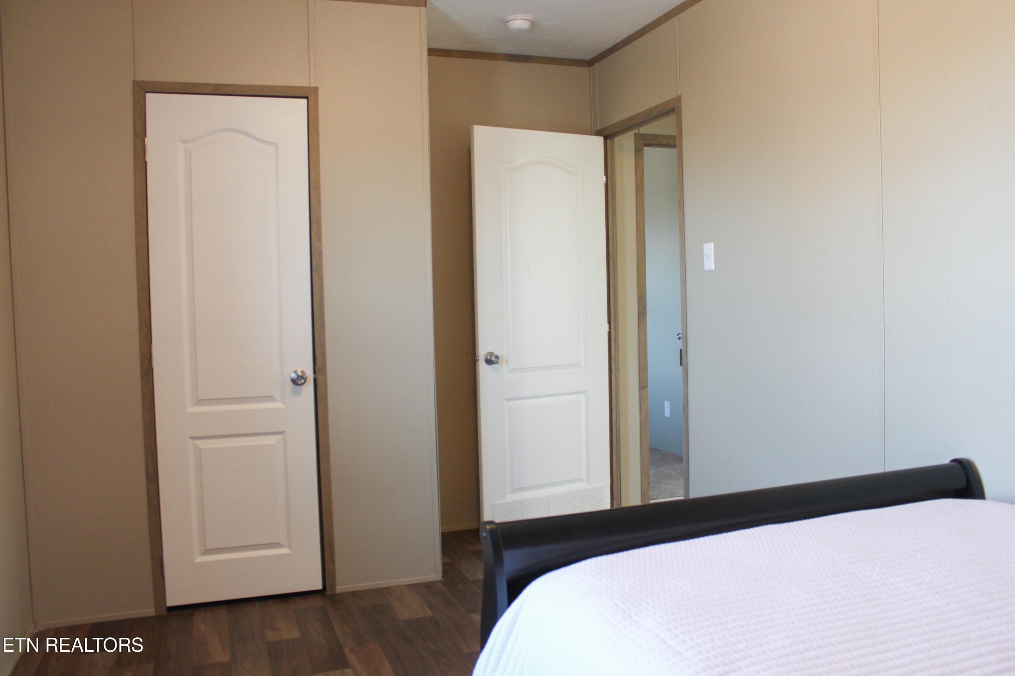 4501 Shipe Road Corryton, TN 37721 - Photo 19 of 32 a bedroom with a bed and wooden floor