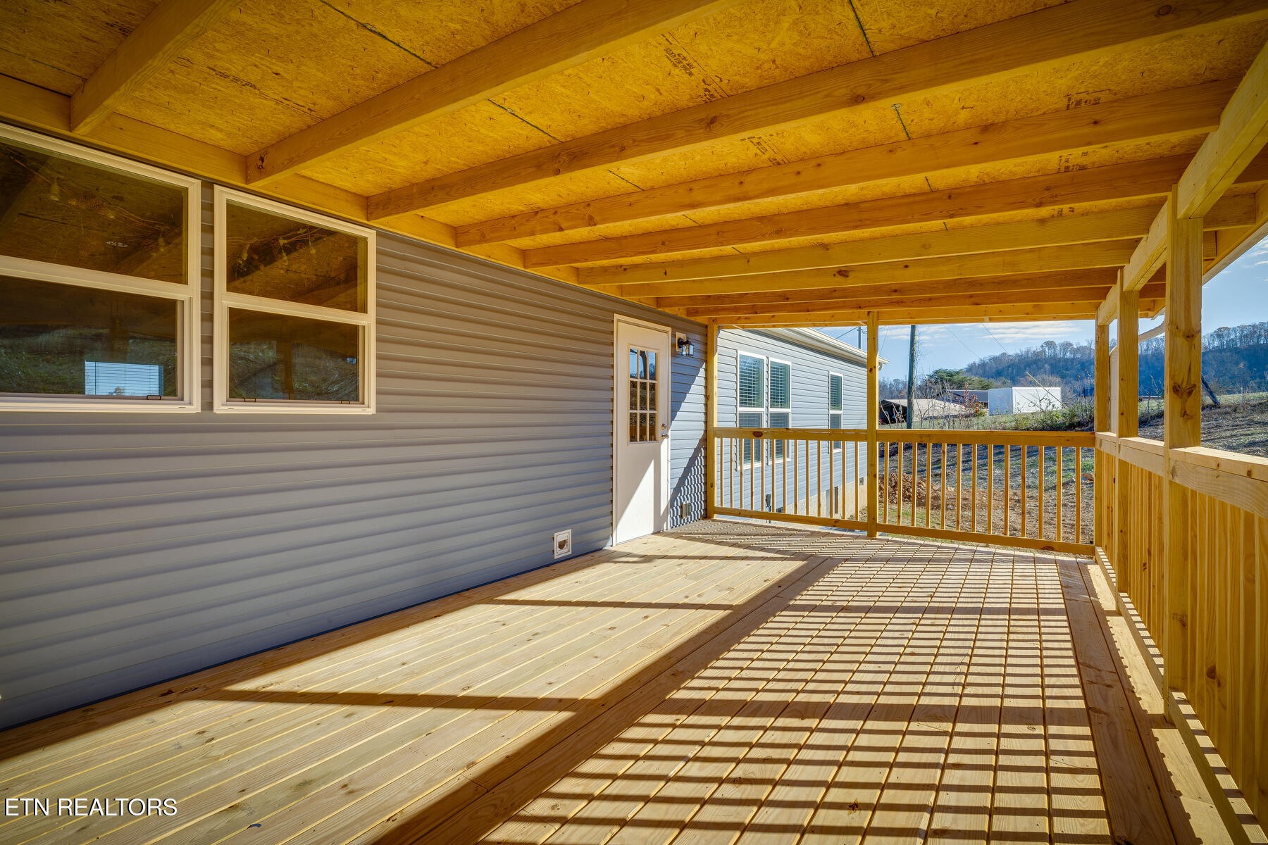 4501 Shipe Road Corryton, TN 37721 - Photo 26 of 32 a view of a balcony with wooden floor