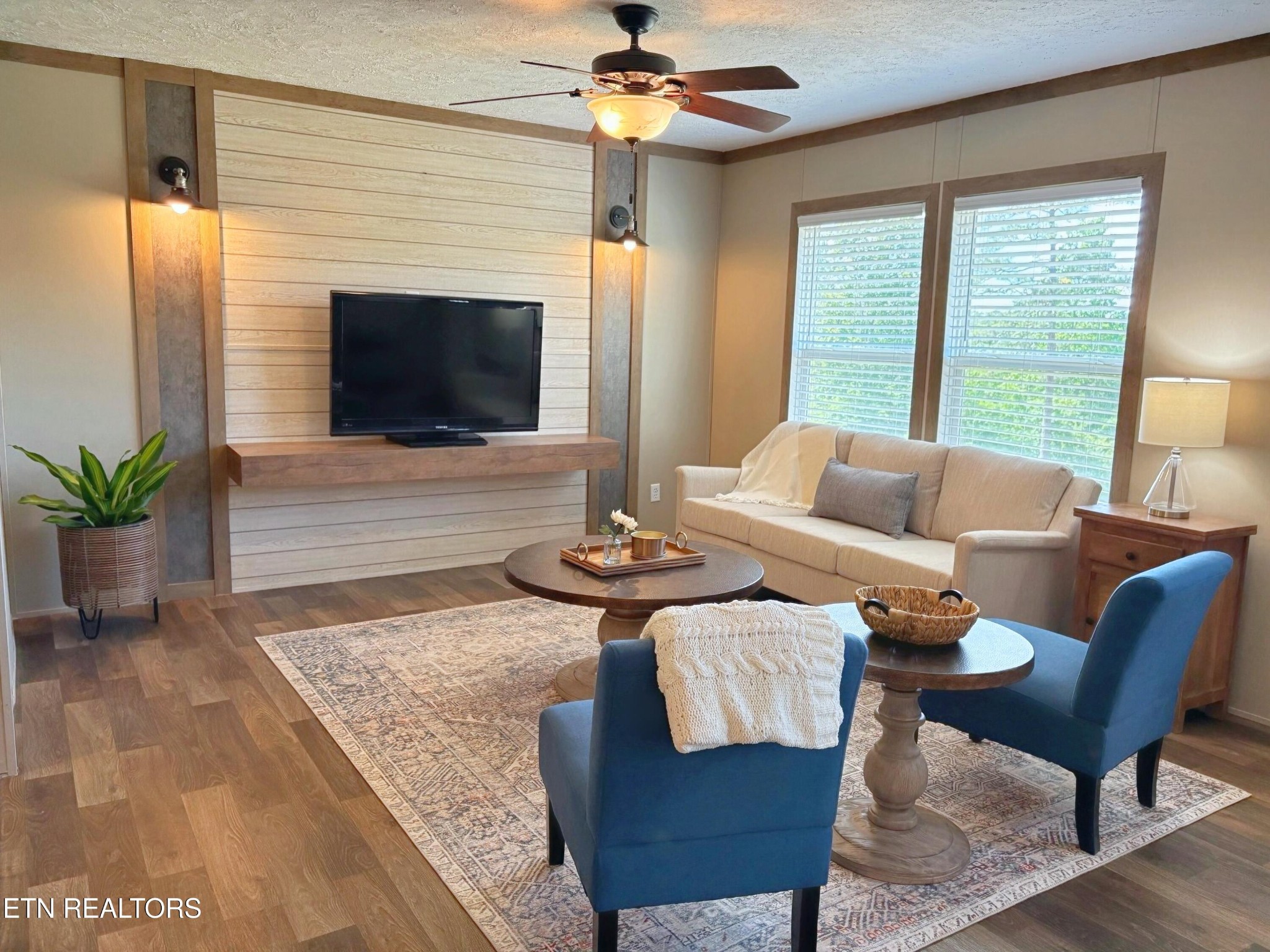 4501 Shipe Road Corryton, TN 37721 - Photo 3 of 32 a living room with furniture a flat screen tv and a fireplace