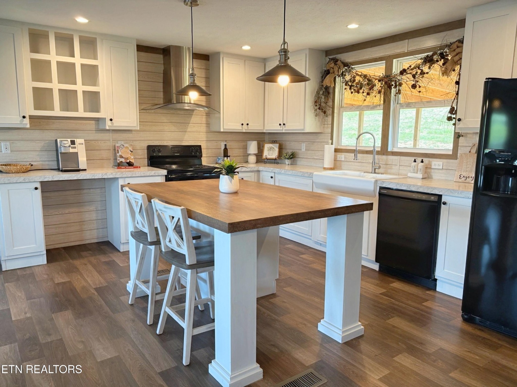 4501 Shipe Road Corryton, TN 37721 - Photo 4 of 32 a kitchen with a table chairs sink and cabinets