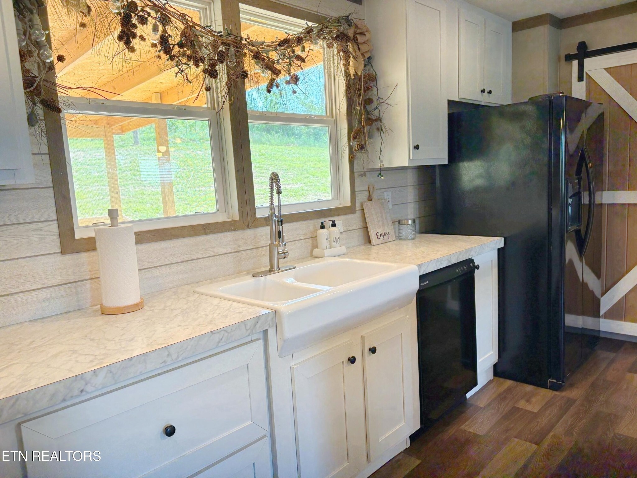 4501 Shipe Road Corryton, TN 37721 - Photo 6 of 32 a kitchen with a sink and a refrigerator