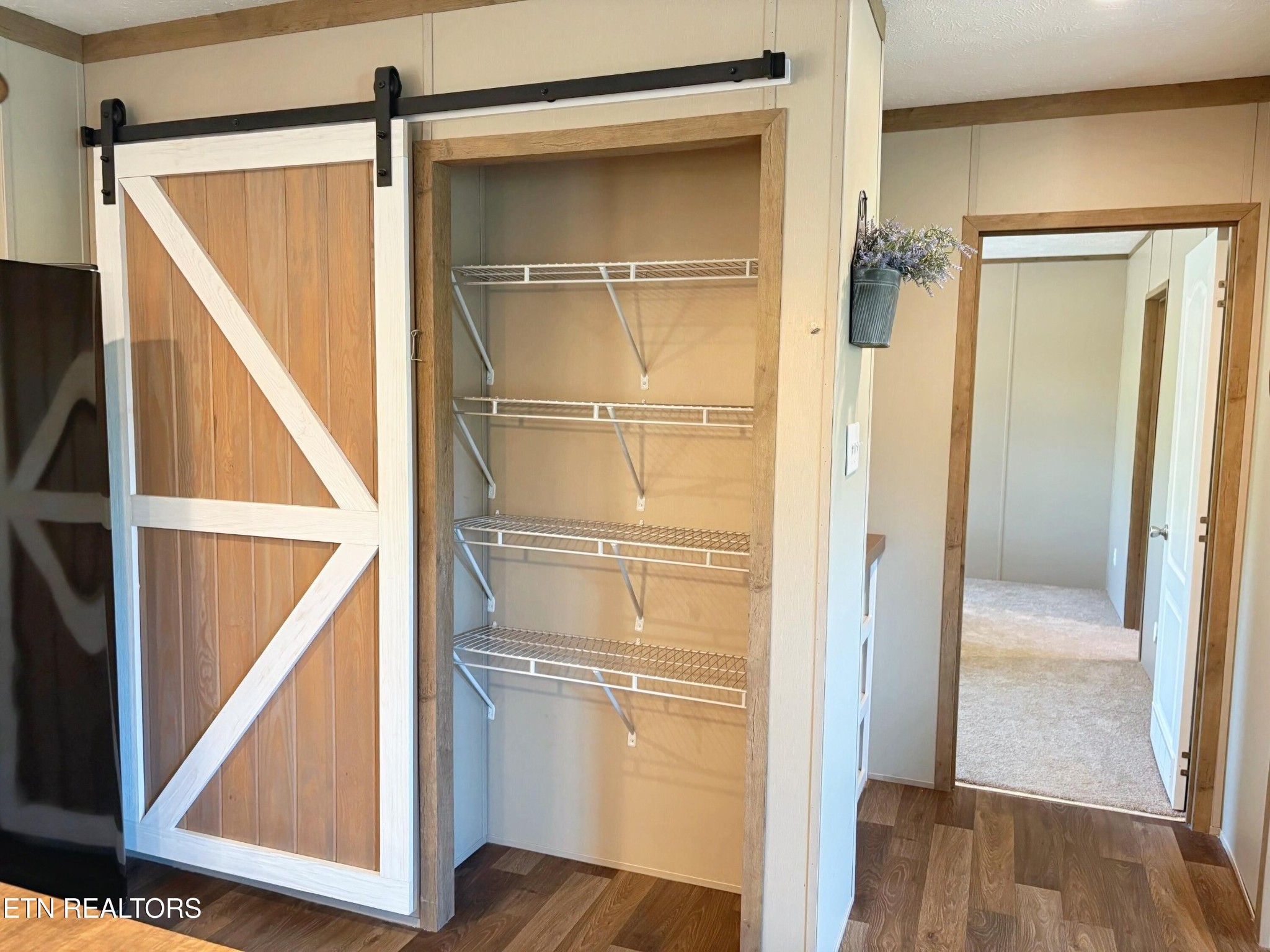 4501 Shipe Road Corryton, TN 37721 - Photo 8 of 32 a view of walk in closet with wooden floor