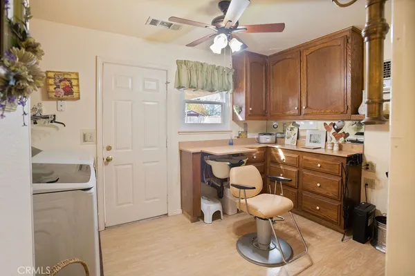 a kitchen with a sink and a refrigerator