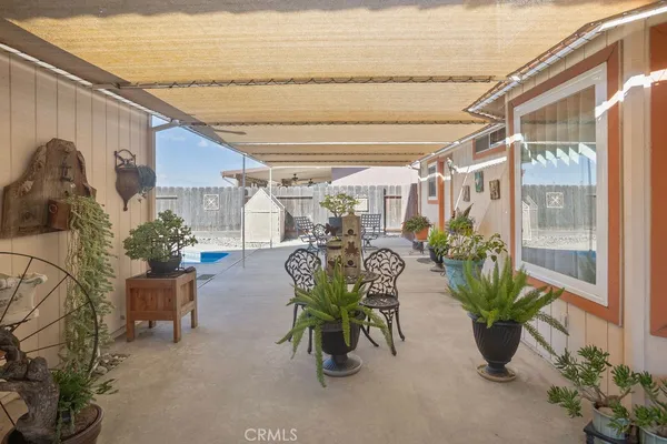 a view of a chairs and table in a patio
