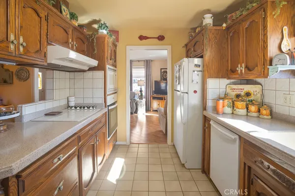 a kitchen with a refrigerator a sink and dishwasher