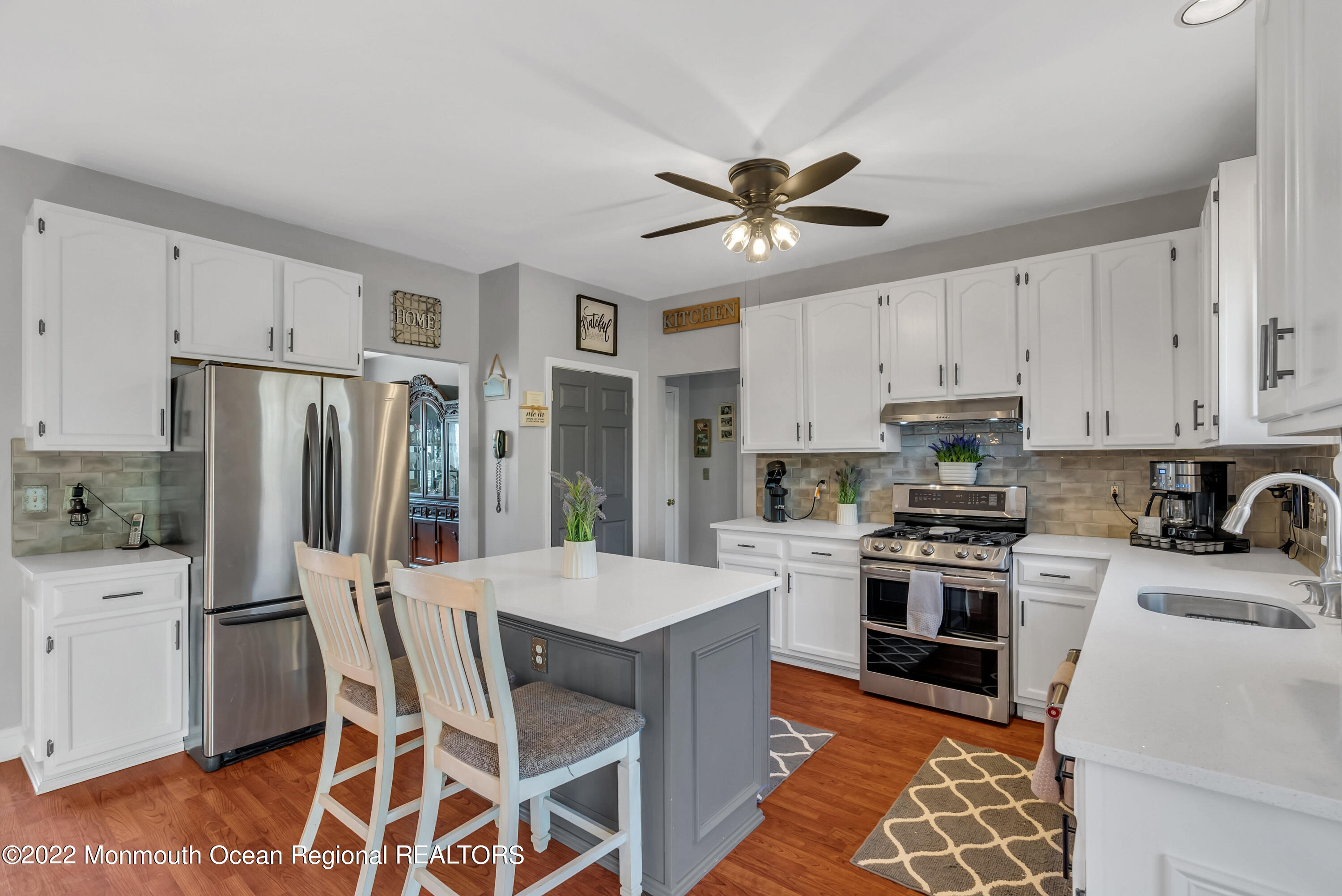 930 Hyson Road Jackson, NJ 08527 - Photo 15 of 38 a kitchen with stainless steel appliances a stove a sink island and a refrigerator