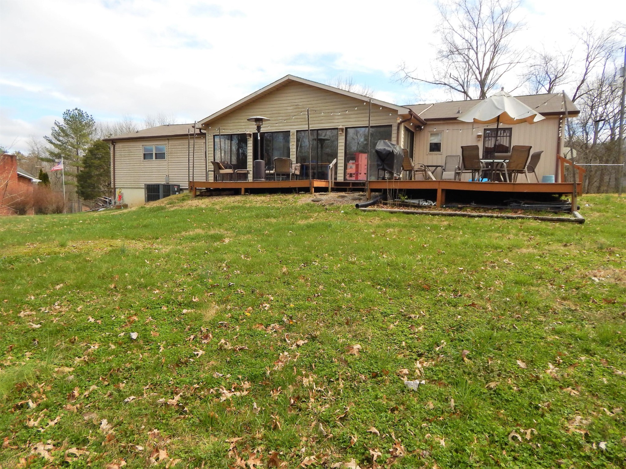 518 Gibbs Ferry Road Clinton, TN 37716 - Photo 24 of 25 a front view of a house with a garden and trees