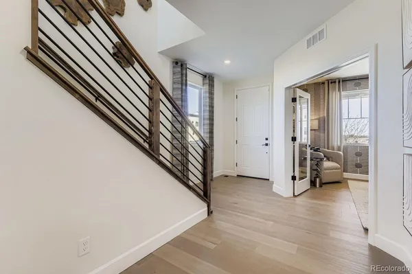 wooden floor in a hall with a window