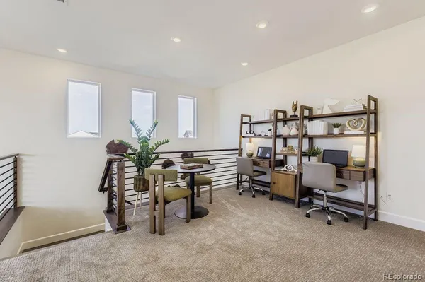 a view of a workspace with furniture