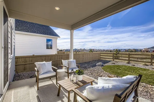 a backyard of a house with outdoor seating