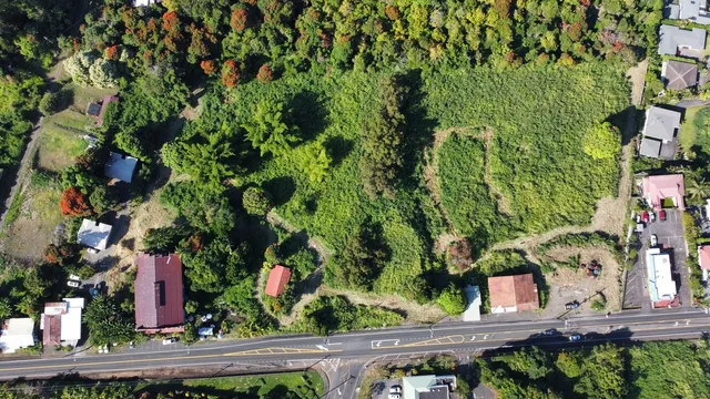 an aerial view of residential house with an outdoor space and street view