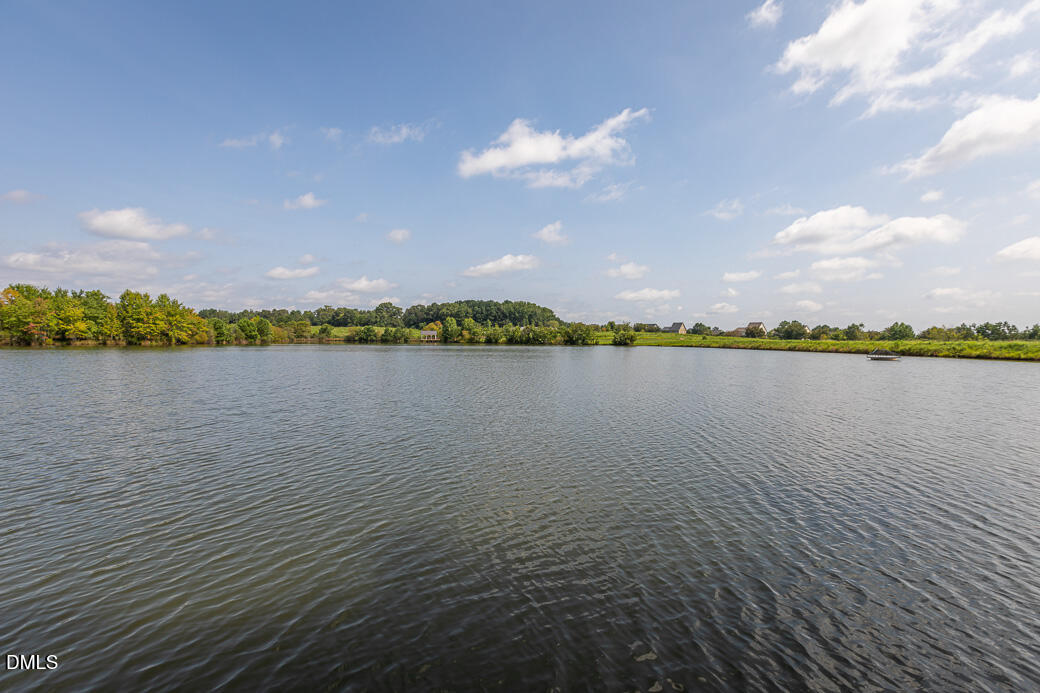 1708 Highpoint Street Wake Forest, NC 27587 - Photo 57 of 63 a view of a lake with houses in the back