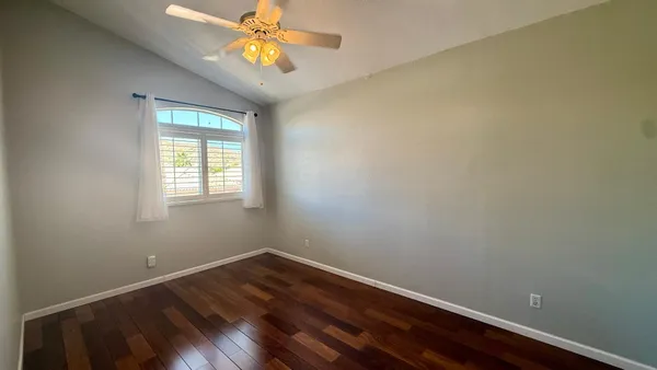 a bathroom with a sink mirror and cabinets