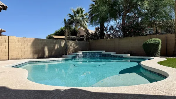 a view of a backyard of a house