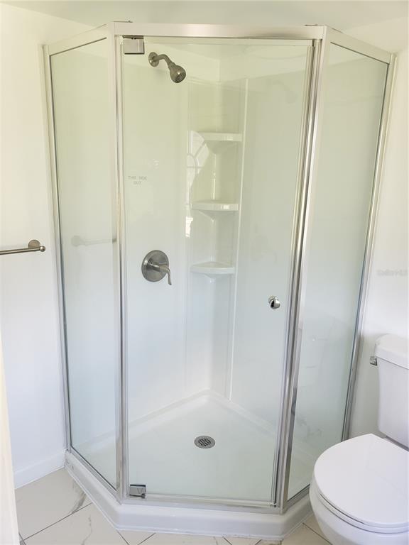 20805 Sheldon Street Orlando, FL 32833 - Photo 11 of 18 a bathroom with a shower and a toilet