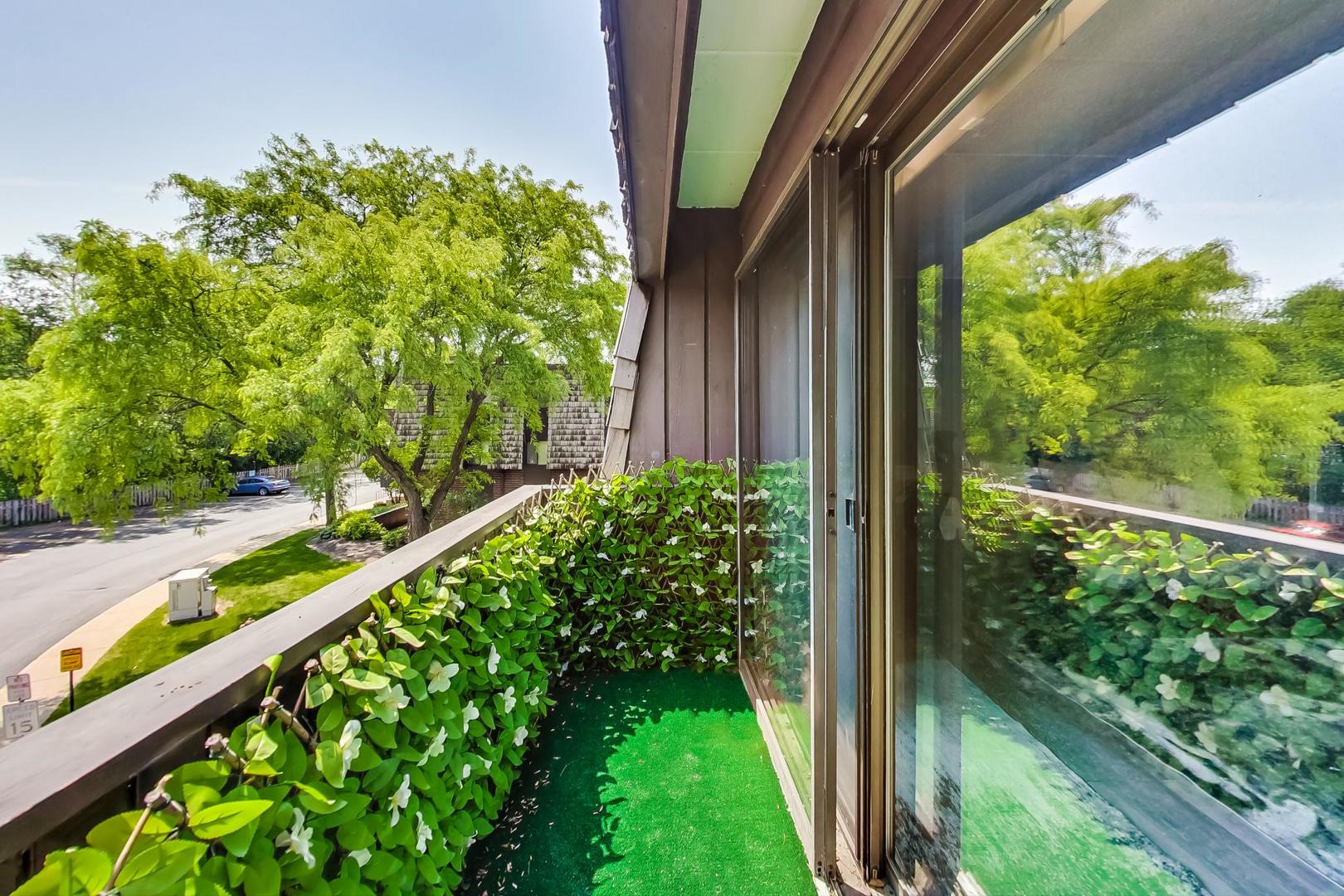 550 Timber Ridge Drive, Unit 304 Carol Stream, IL 60188 - Photo 17 of 22 a view of a garden