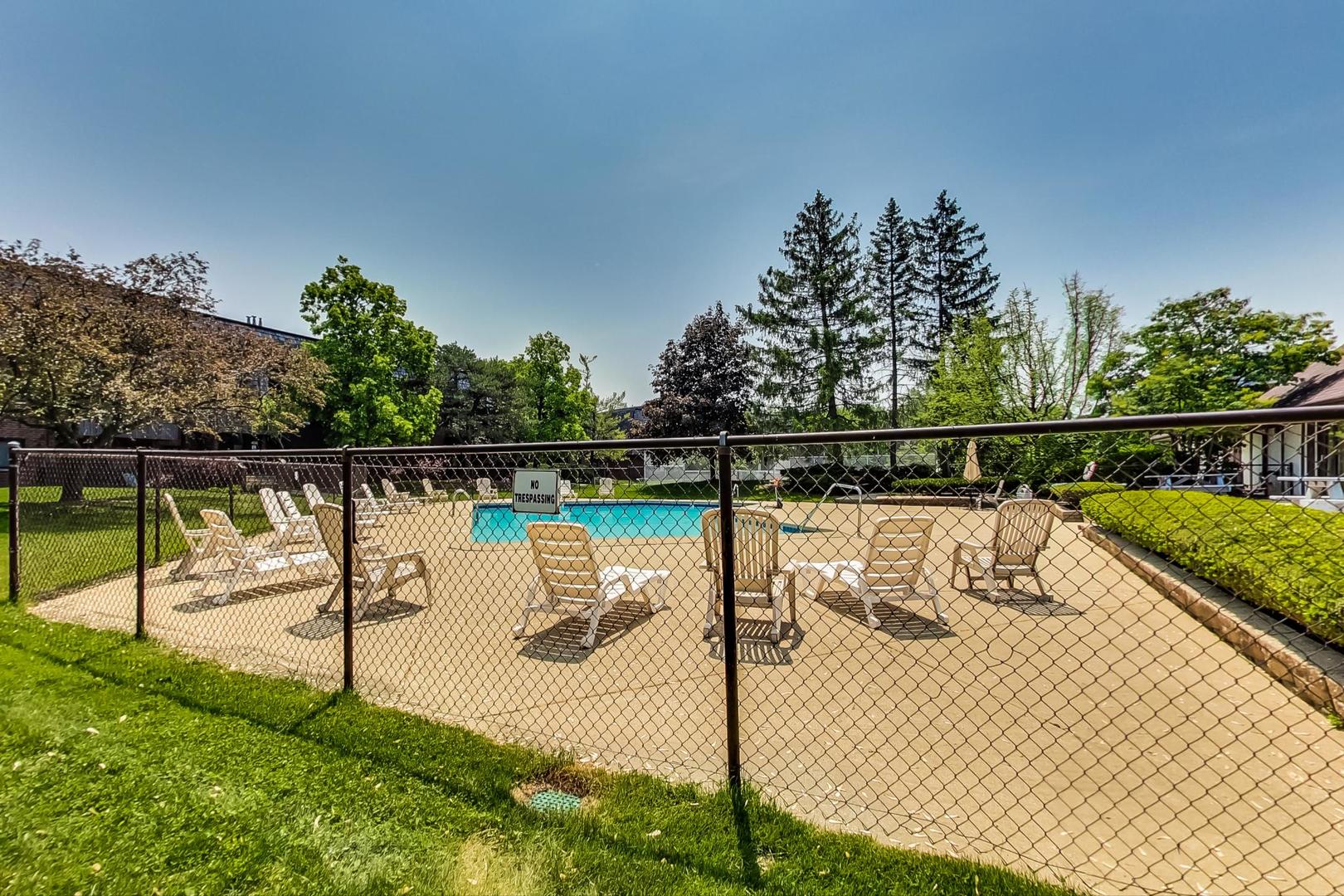 550 Timber Ridge Drive, Unit 304 Carol Stream, IL 60188 - Photo 21 of 22 a view of a swimming pool with a deck