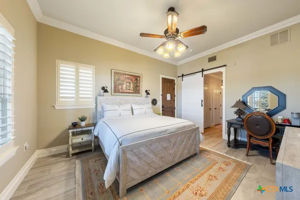a view of roof deck with two chairs and wooden floor
