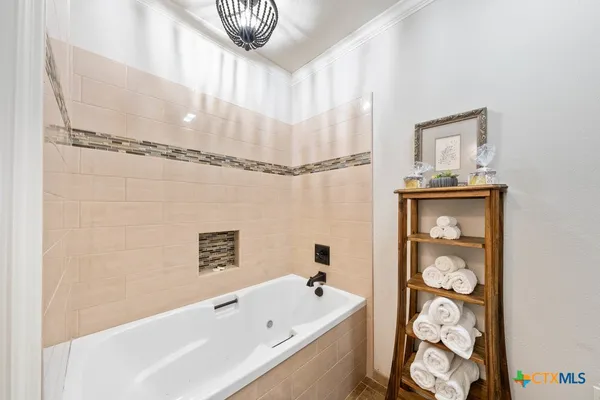 a bathroom with a granite countertop toilet a sink and a mirror