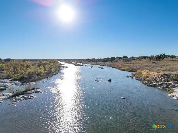a living room with furniture and flowers