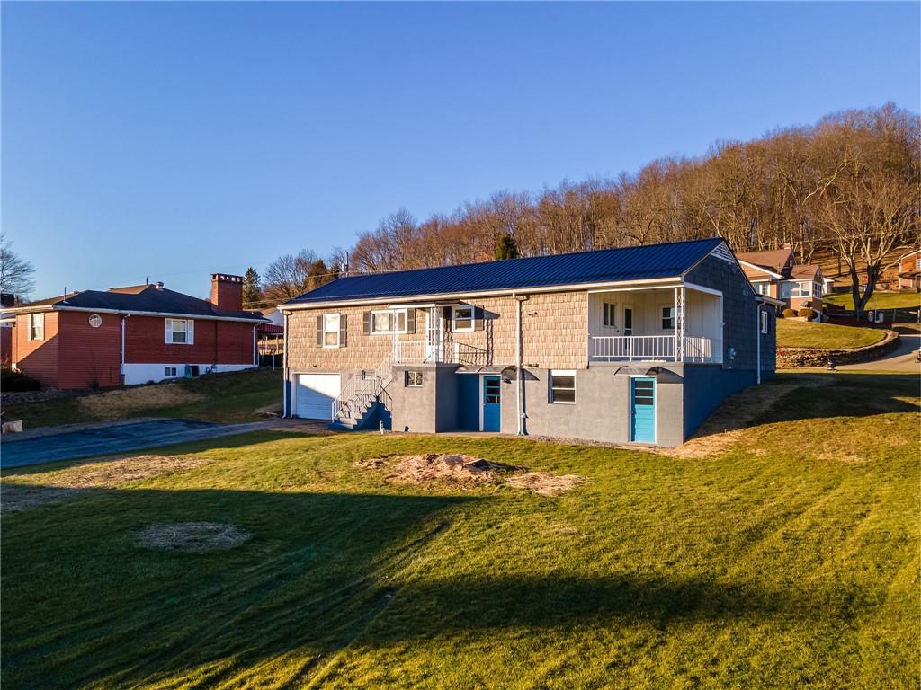 708 Middle 1st Street Rural Valley, PA 16249 - Photo 21 of 22 a view of swimming pool with outdoor seating and house in the background