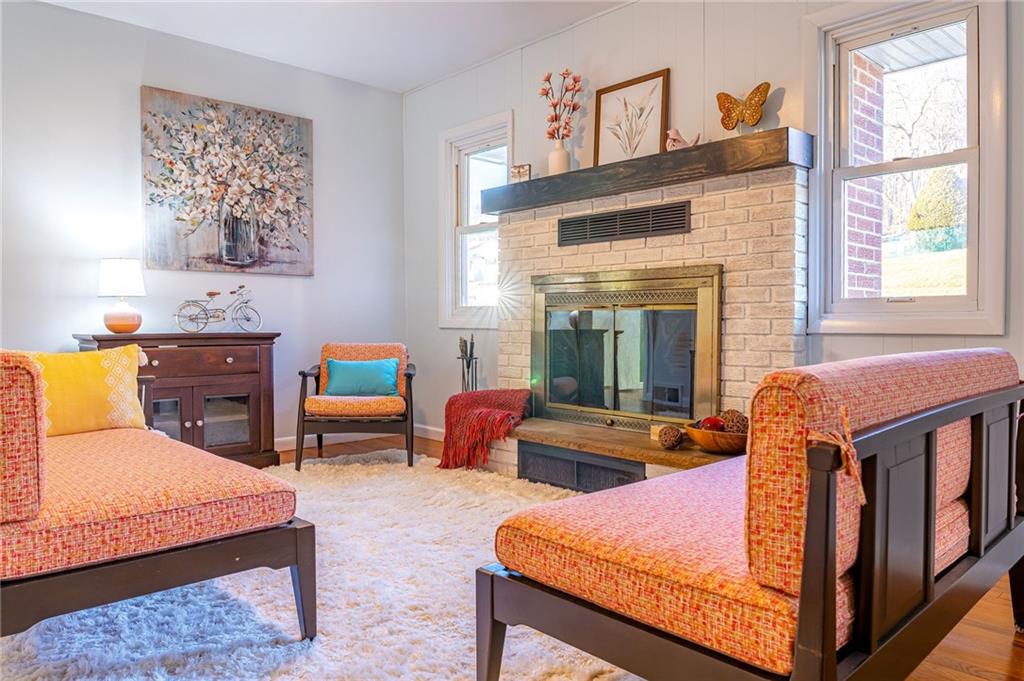708 Middle 1st Street Rural Valley, PA 16249 - Photo 5 of 22 a living room with furniture a window and a fireplace