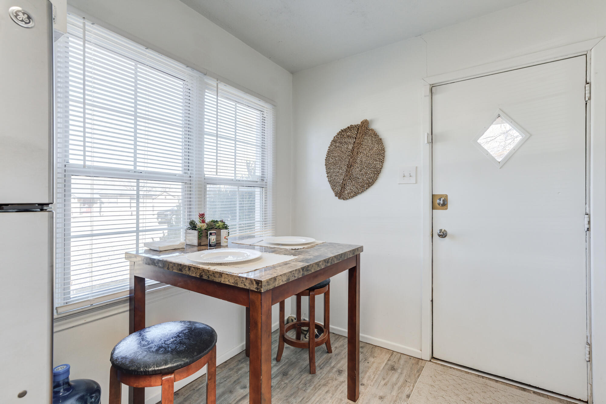 4503 45th Street Lubbock, TX 79414 - Photo 11 of 27 a view of a room that has a table and a chair in it