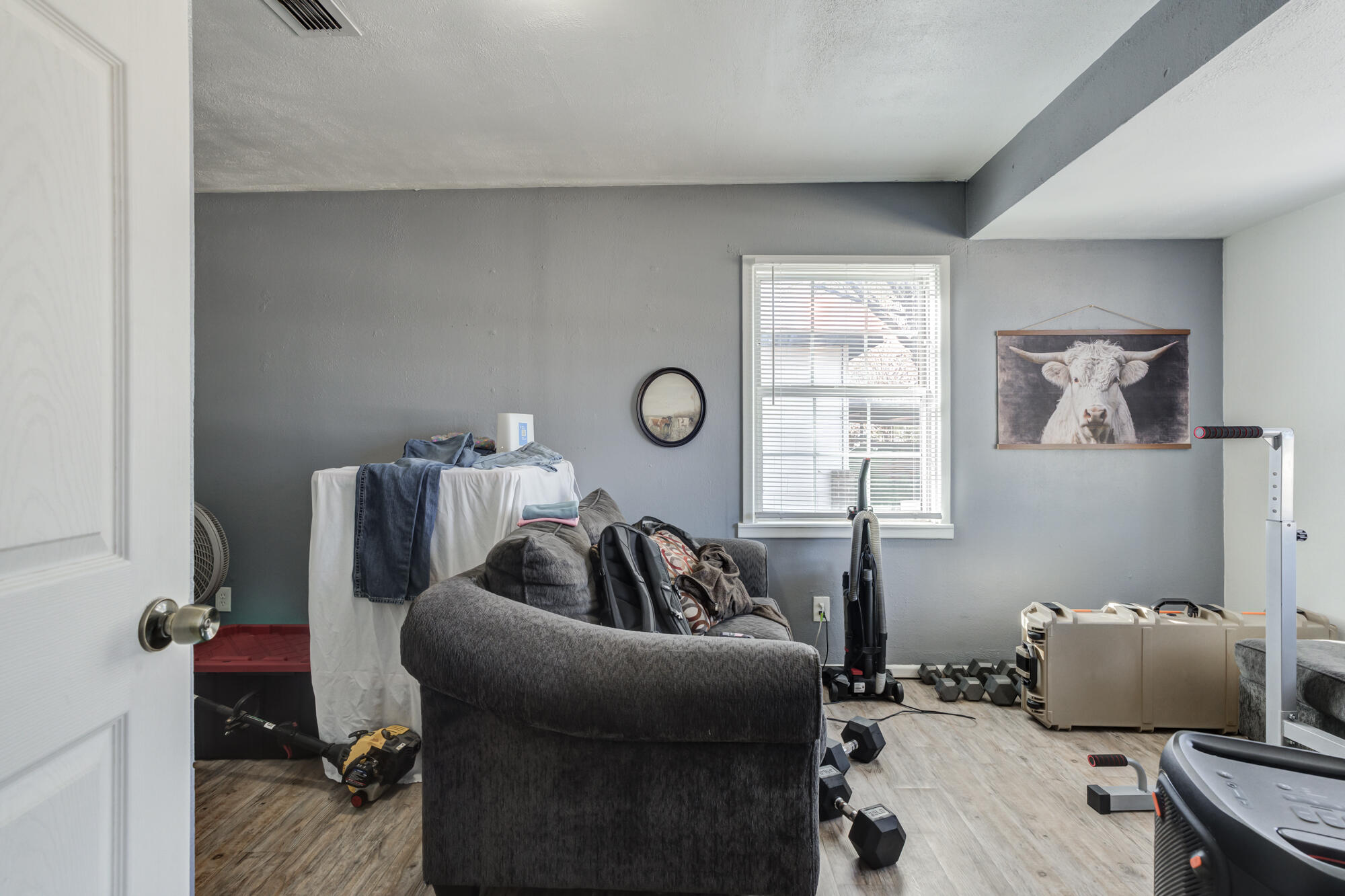 4503 45th Street Lubbock, TX 79414 - Photo 12 of 27 a living room with furniture and a window