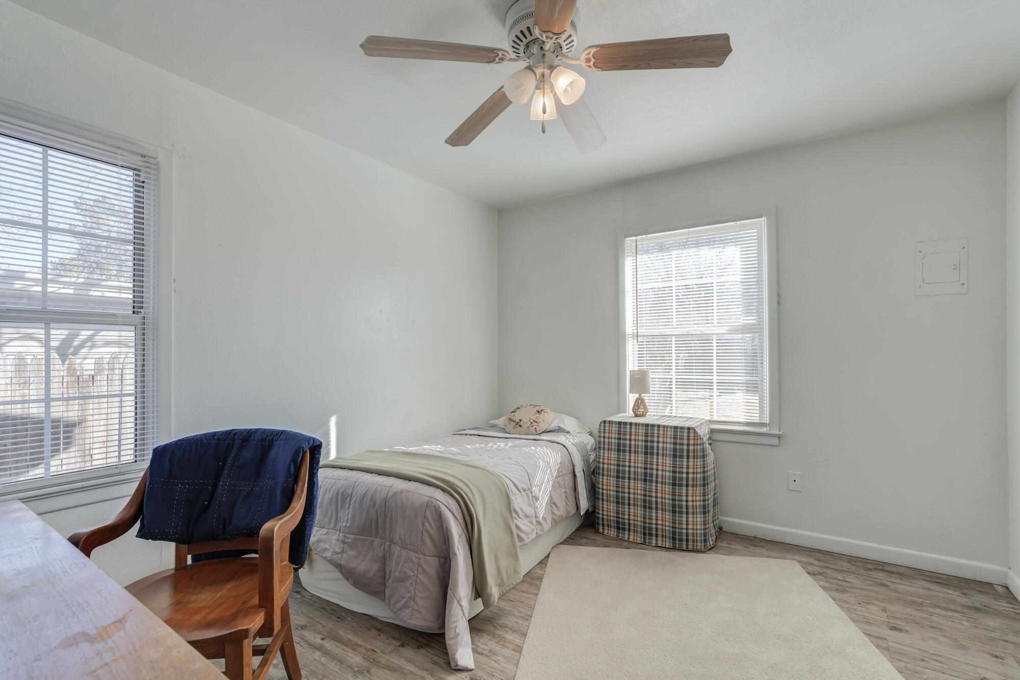 4503 45th Street Lubbock, TX 79414 - Photo 20 of 27 a bedroom with a bed and a window