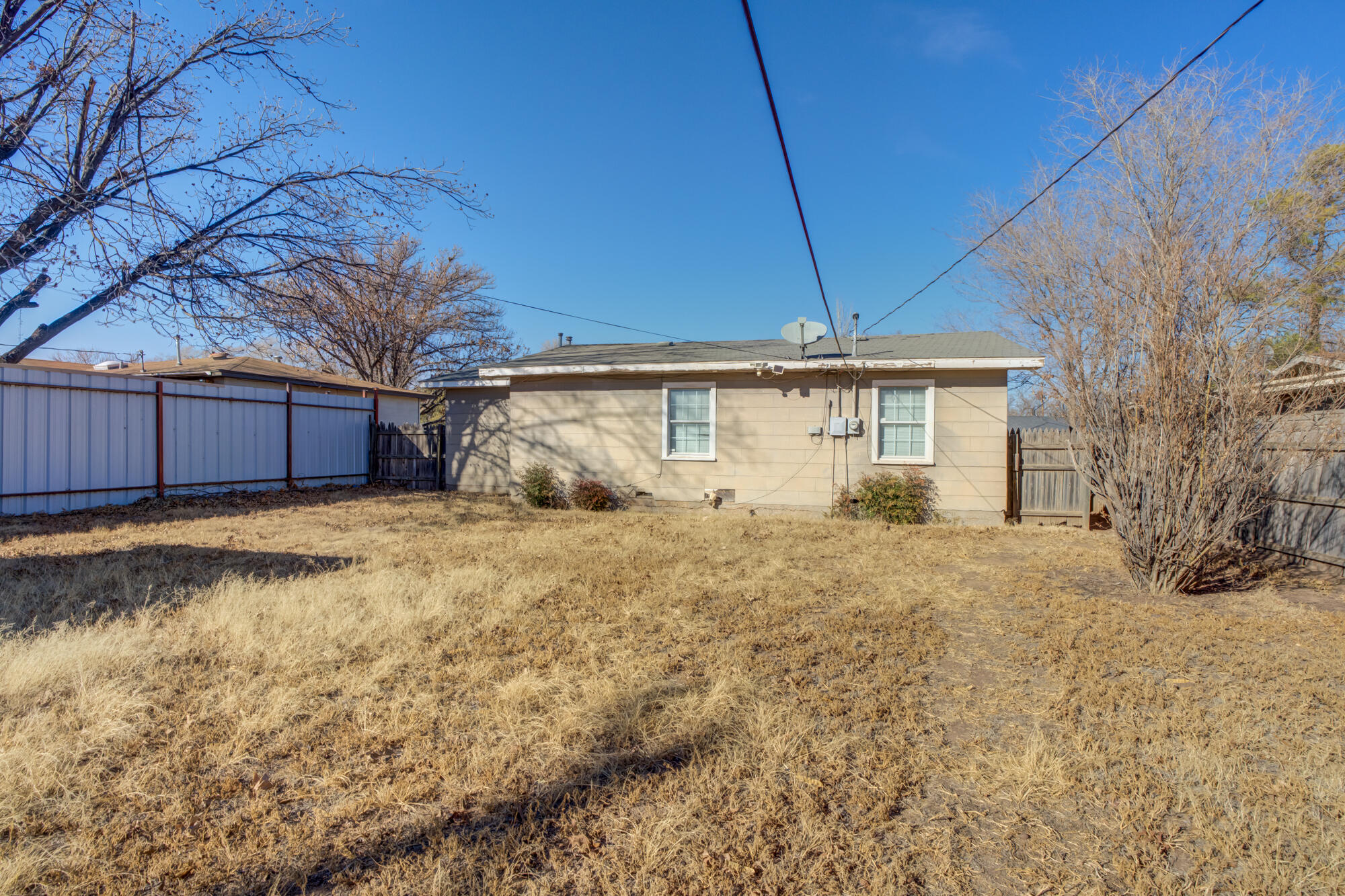 4503 45th Street Lubbock, TX 79414 - Photo 26 of 27 a front view of a house with a yard