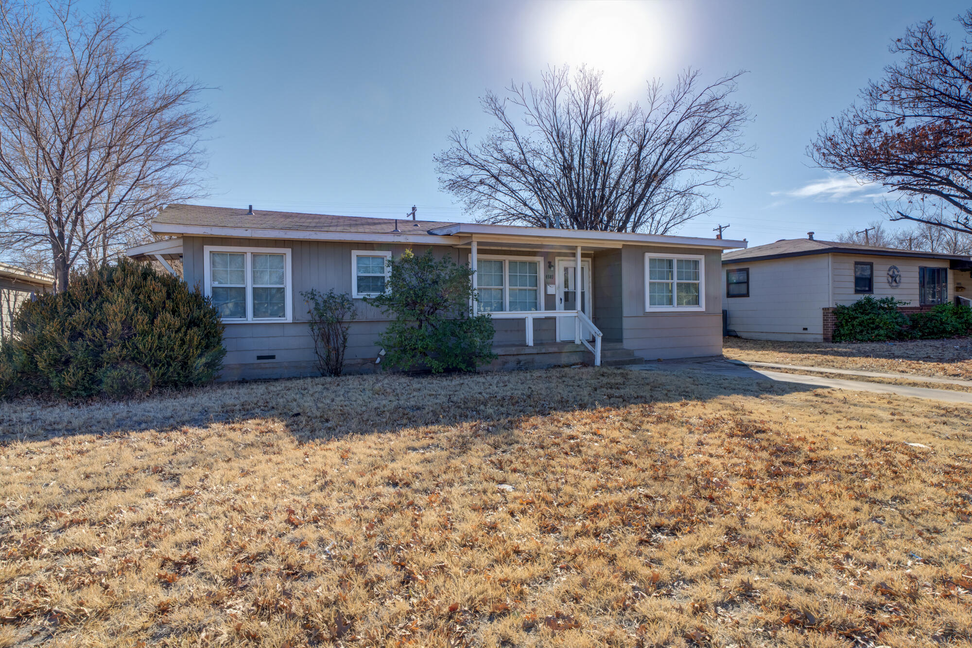 4503 45th Street Lubbock, TX 79414 - Photo 27 of 27 a front view of house with yard and trees around