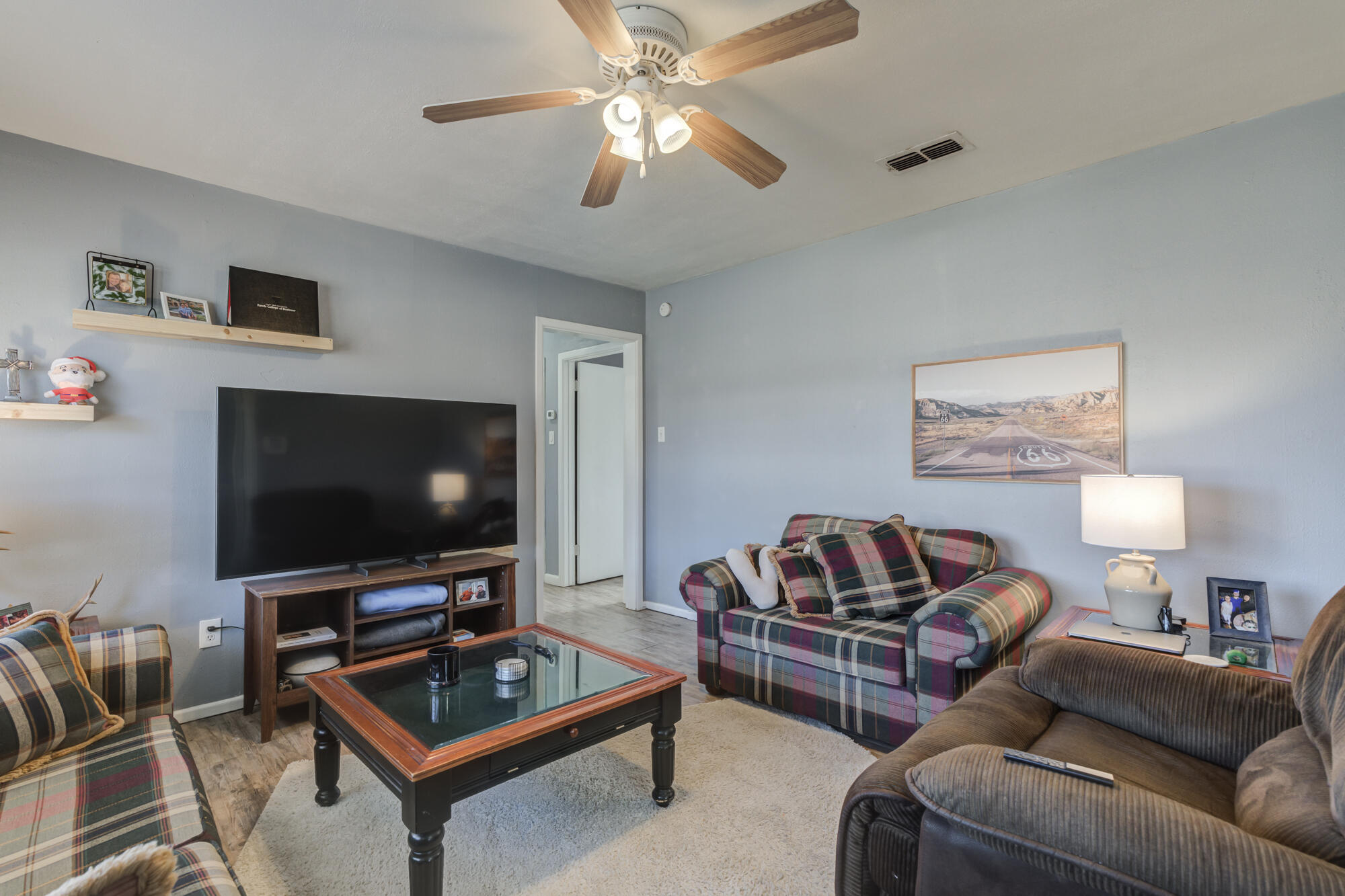 4503 45th Street Lubbock, TX 79414 - Photo 3 of 27 a living room with furniture and a flat screen tv