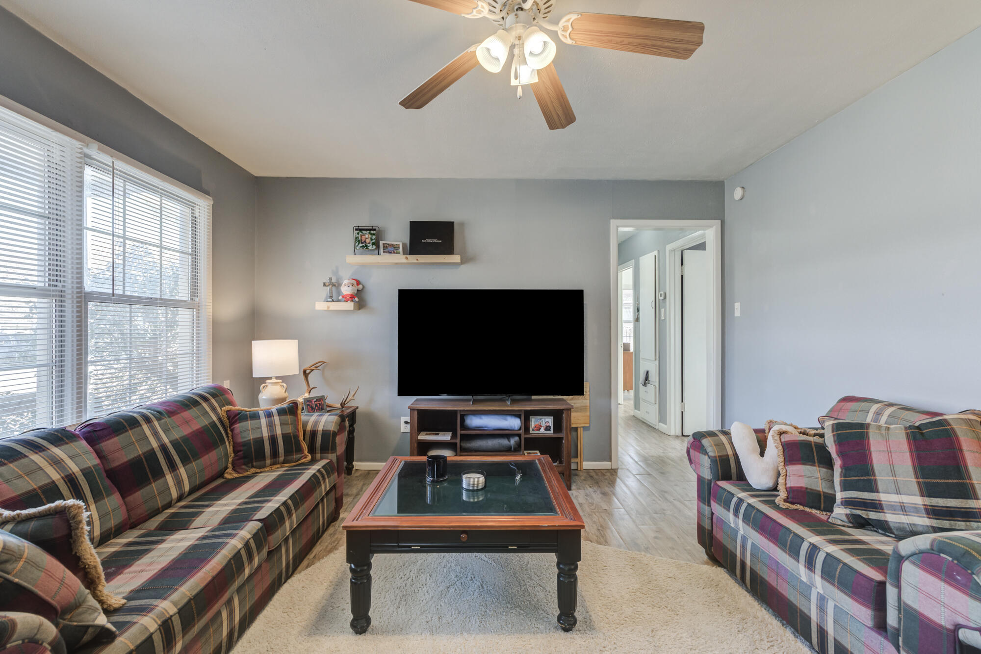 4503 45th Street Lubbock, TX 79414 - Photo 4 of 27 a living room with furniture and a flat screen tv