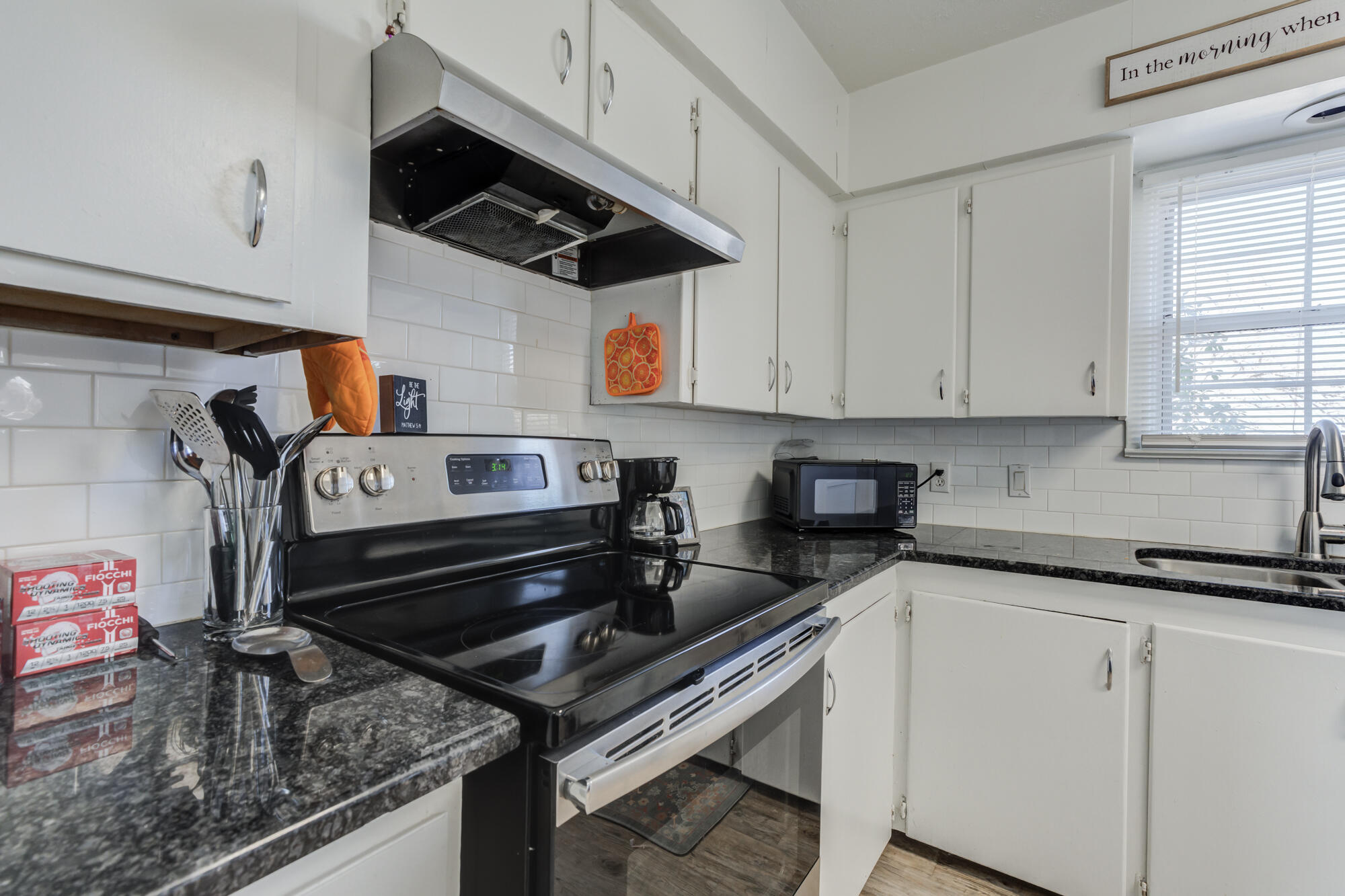 4503 45th Street Lubbock, TX 79414 - Photo 8 of 27 a kitchen with stainless steel appliances granite countertop a sink stove and cabinets